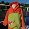 alt="bright orange boys t-rex spike hoodie"