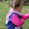 model wearing axolotl hoodie side view