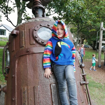 model wearing toucan hoodie in park