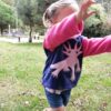 running model wearing axolotl hoodie