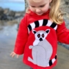 girl looking down onto a ring tail lemur hoodie