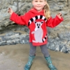 girl wearing red ring tail lemur hoodie