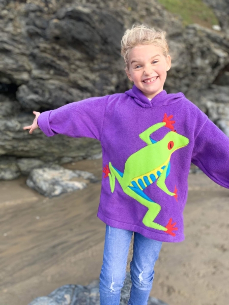 happy girl wearing a tree frog hoodie