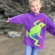 happy girl wearing a tree frog hoodie