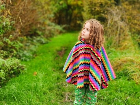 girl wearing zigzag poncho
