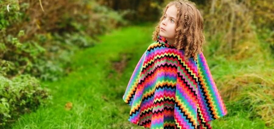 girl wearing zigzag poncho