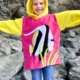 girl wearing tropical fish hoodie
