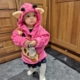 little girl wearing a giraffe applique hoodie with ears and horns on the hood