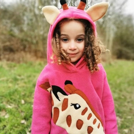 girl wearing giraffe hoodie with ears